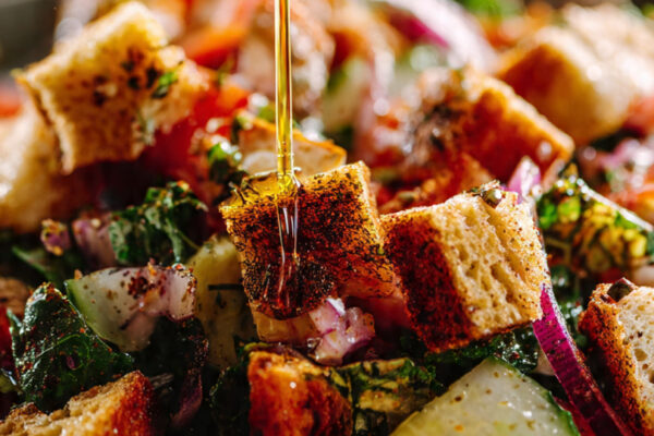 close-up-action-shot-of-olive-oil-and-lemon-dressi