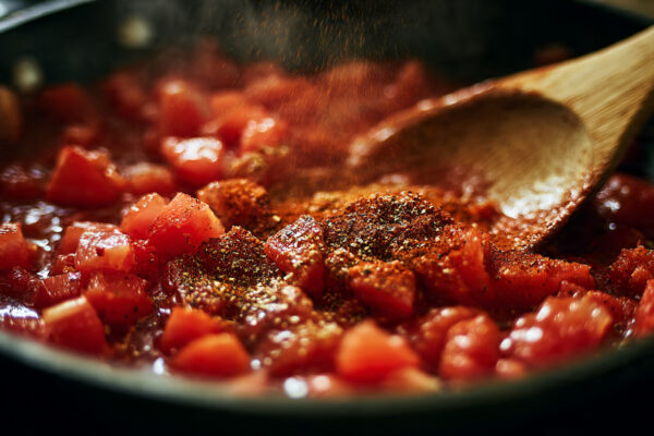 close-up-overhead-shot-of-a-skillet-with-diced-tom
