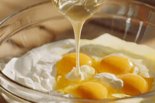 close-up-ultra-realistic-photo-of-eggs-being-whisk