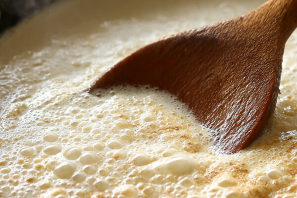 heavy-bottom-pan-with-milk-simmering-slowly-thick-