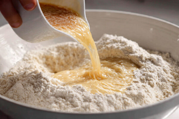 slowly-pouring-smooth-wet-ingredients-into-a-large