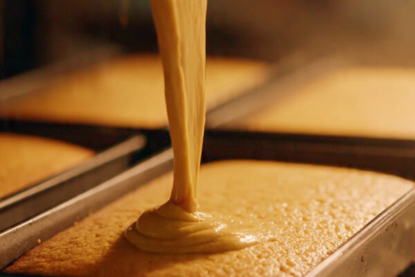 ultra-realistic-photo-of-golden-cake-batter-poured